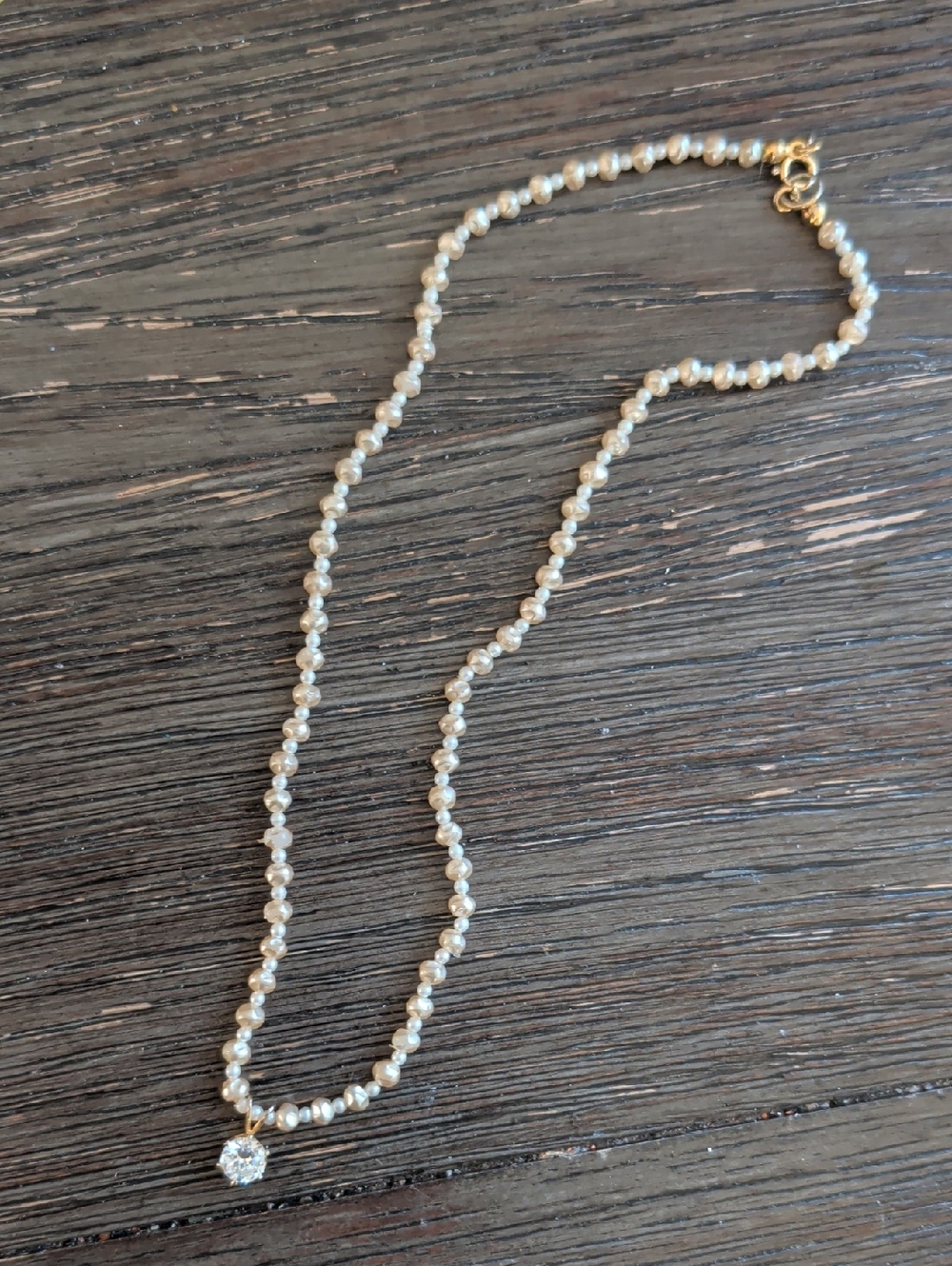 Pearl Beaded Necklace with Gold Accents and Sparkling Pendant